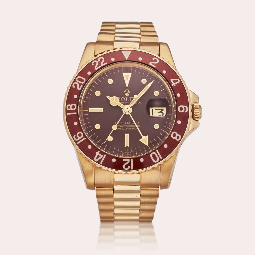 View full screen - View 1 of Lot 80. Reference 1675 GMT-Master 'Root Beer' | A yellow gold automatic dual time wristwatch with date, bracelet, and nipple dial, Circa 1978.