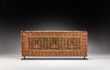 View full screen - View 1 of Lot 41. A carved gilt and polychrome wood sutra book cover, Tibet, 14th / 15th century | 十四 / 十五世紀 藏傳金加彩木雕護經板.