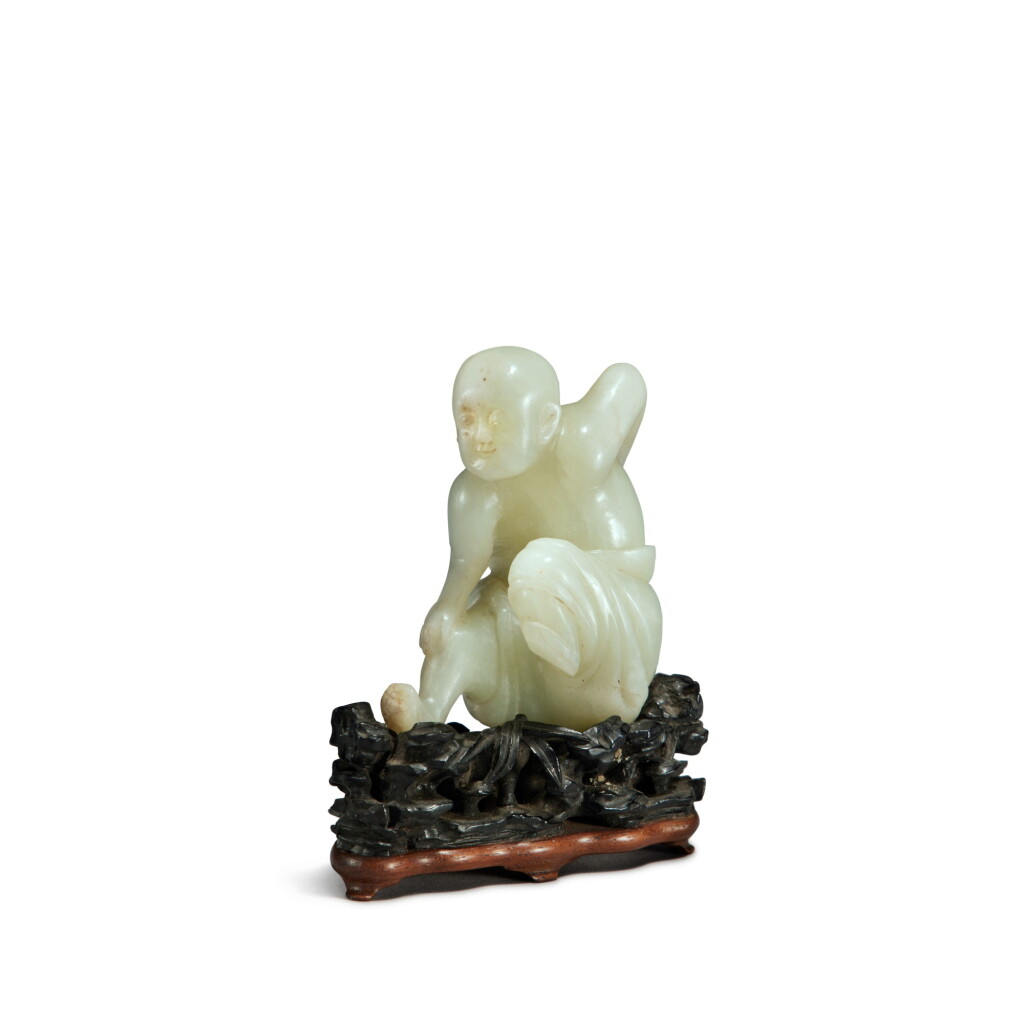 View full screen - View 1 of Lot 26. A pale celadon jade figure of a luohan, Qing dynasty, 18th century | 清十八世紀 青白玉雕羅漢坐像.