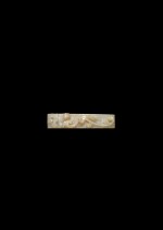 A finely carved jade 'Three Guardians' scabbard slide, Western Han dynasty | 西漢 玉雕三靈紋劍璏