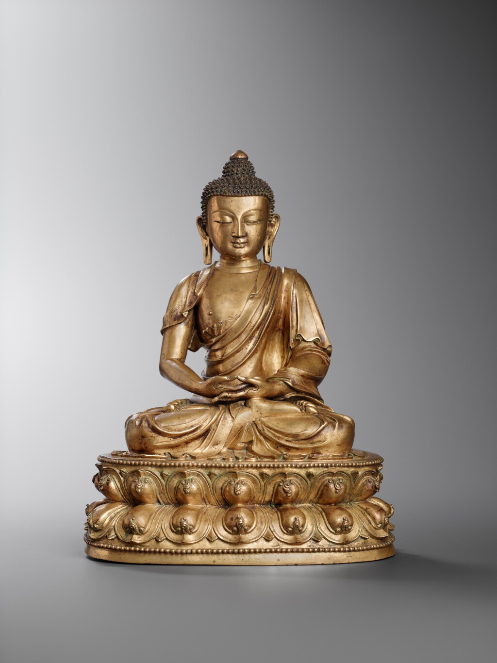 View full screen - View 1 of Lot 8. A copper-alloy figure of Amitabha Buddha, Ming dynasty, 15th century.
