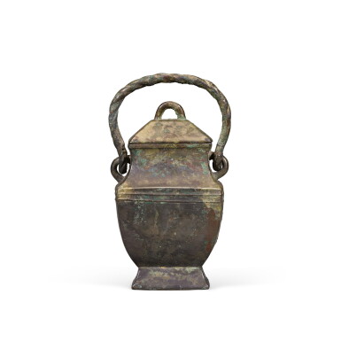 View full screen - View 1 of Lot 239. A small archaic bronze ritual wine vessel and cover (You), Late Shang dynasty | 商末 亞共且乙父己卣.