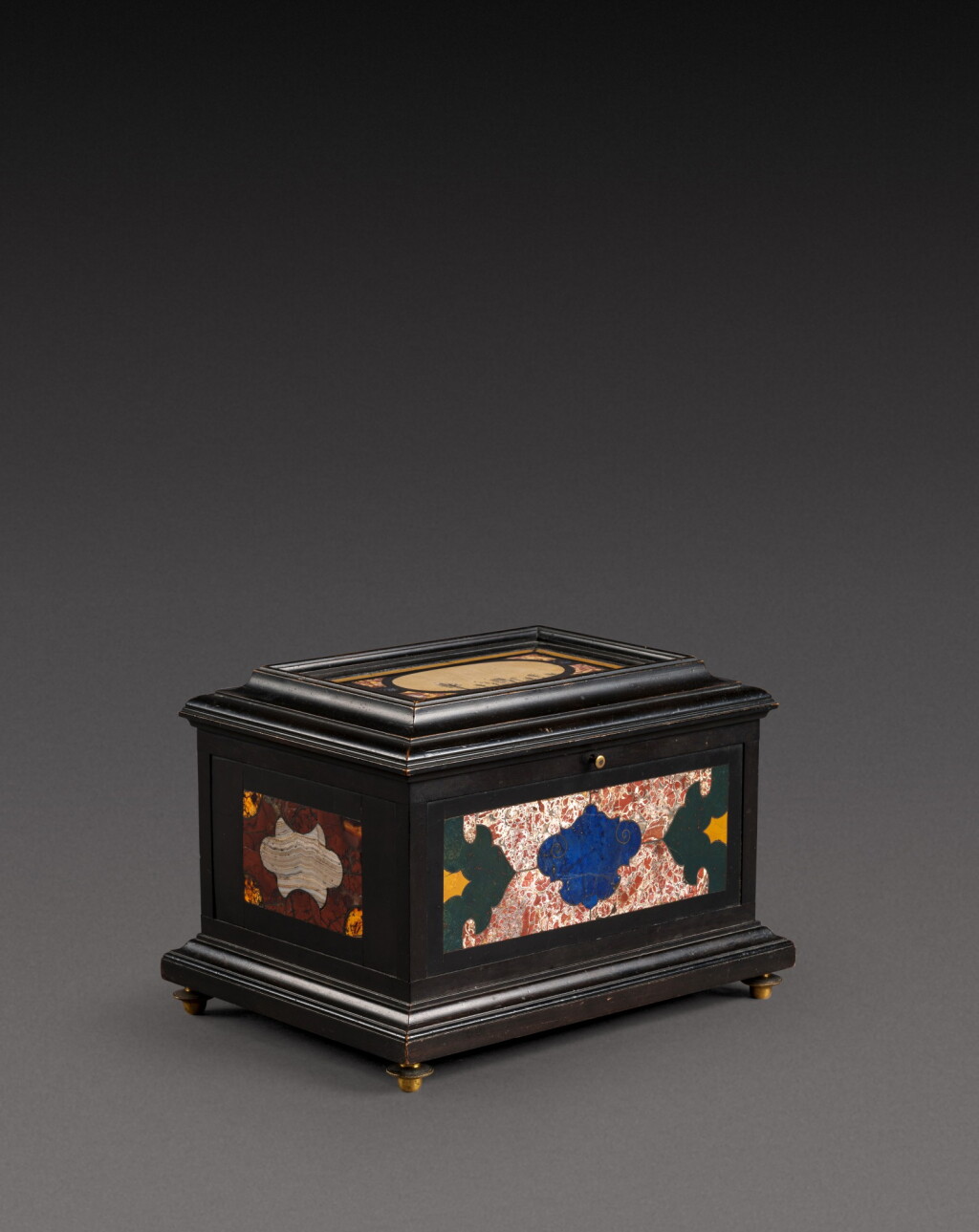 View full screen - View 1 of Lot 179. An Italian pietra paesina and hardstones inlaid ebonised casket, the panel in the lid, Florence, 18th century, the other panels, Rome and 17th century; the casket late 19th century/early 20th century.