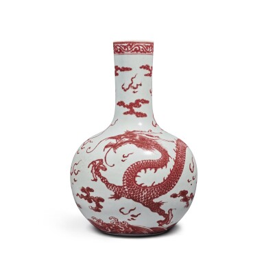 View full screen - View 1 of Lot 136. A copper-red-decorated 'dragon' vase (Tianqiuping), Qing Dynasty, 18th century | 清十八世紀 釉裏紅雲龍趕珠紋天球瓶.