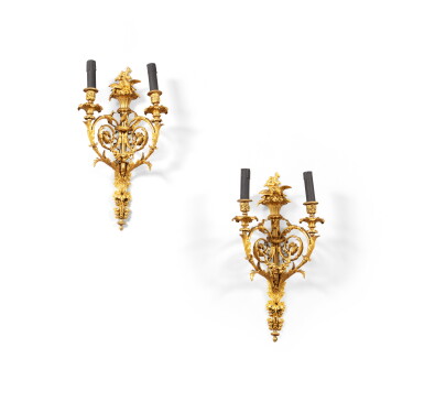 View full screen - View 1 of Lot 224. A pair of gilt-bronze two-light wall appliques, French Restauration, circa 1820, after a model by Pierre-François Feuchère | Paire d'appliques à deux lumières en bronze doré d'époque Restauration, vers 1820, d'après un modèle de Pierre-François Feuchère.