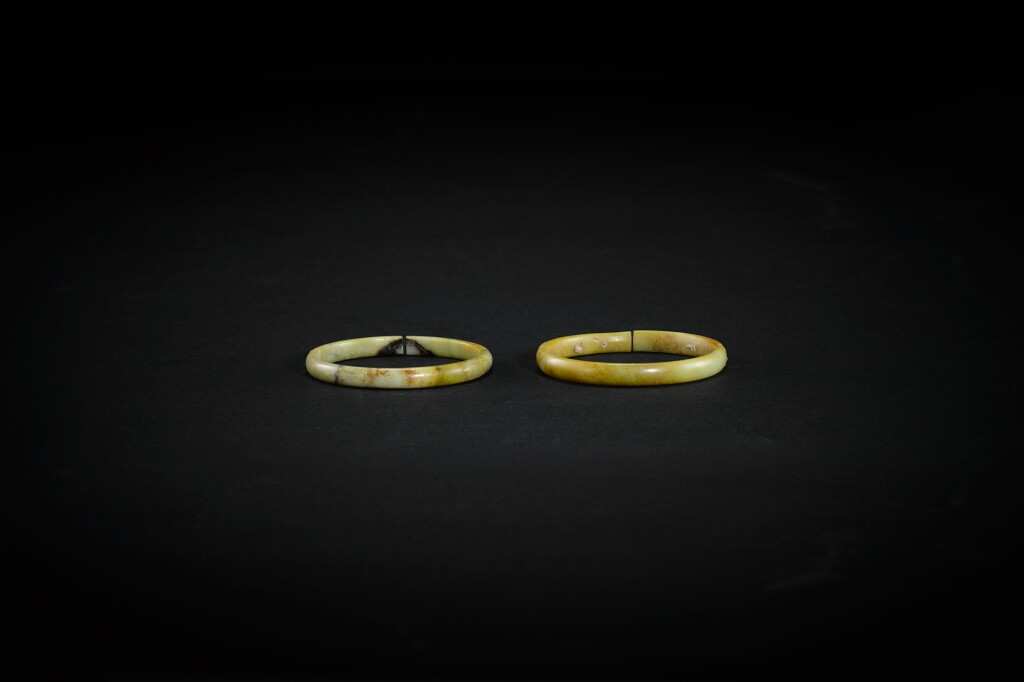 View full screen - View 1 of Lot 3781. Two calcified jade slit rings, jue, Neolithic period | 新石器時代 玉玦兩件.