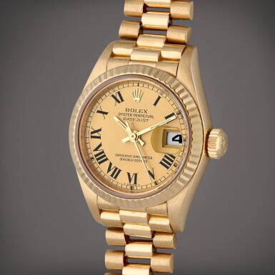View full screen - View 1 of Lot 42. Reference 69178 Lady DateJust | A yellow gold wristwatch with date and bracelet, Circa 1990.