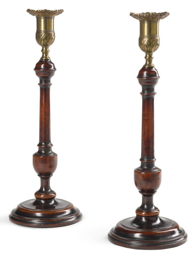 View full screen - View 1 of Lot 86. A PAIR OF GEORGE III TURNED MAHOGANY CANDLESTICKS, CIRCA 1770.