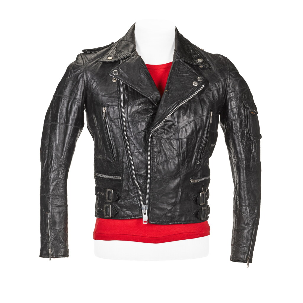 View full screen - View 1 of Lot 209. Freddie Mercury's black leather biker jacket, black vinyl trousers, red T-shirt and red suede shoes, 1980s.