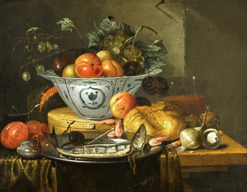 View full screen - View 1 of Lot 146. Still life of peaches, plums and a bunch of white grapes in a Wan-Li porcelain bowl resting on a wooden box, a sliced herring in a pewter dish with shrimps and a plum, a bread roll, two onions, a glass and other fruit on a table draped with a green tablecloth.
