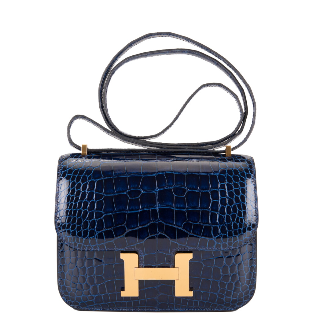 View full screen - View 1 of Lot 3. Hermès Bleu Saphir Constance 18cm of Shiny Alligator with Gold Hardware.