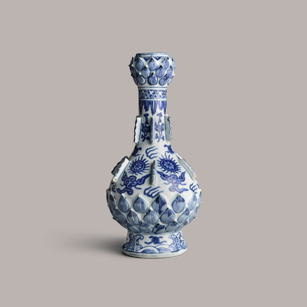 View full screen - View 1 of Lot 357. A blue and white pear shaped garlic neck 'lotus' vase Ming dynasty, wanli period | 明萬曆 青花模印蓮蓬口蒜頭瓶.