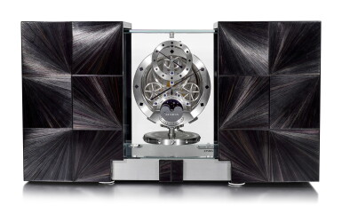 View full screen - View 1 of Lot 194. JAEGER-LECOULTRE | ATMOS MARQUETERIE PAILLE, REFERENCE Q5556302, AN EXCEPTIONAL LIMITED EDITION ATMOS CLOCK WITH REGULATOR DIAL, MOON PHASES, LUNAR CALENDAR, DAY AND NIGHT INDICATION AND HANDMADE MARQUETRY EXPANDING CASE TO REVEAL THE TIME, CIRCA 2012.