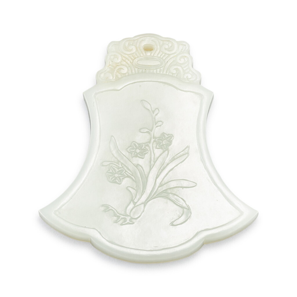 View full screen - View 1 of Lot 536. A large inscribed white jade 'narcissus' plaque Qing dynasty, 18th century | 清十八世紀 白玉題字水仙紋牌 「凌氵叚仙子」字.