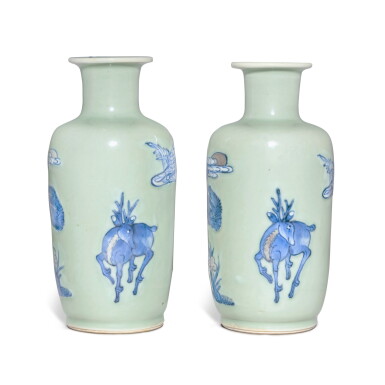 View full screen - View 1 of Lot 559. A pair of celadon-ground underglaze-blue and copper-red 'longevity' rouleau vases, Qing dynasty, Kangxi period | 清康熙 豆青地青花釉裏紅松樹靈芝鶴鹿同春圖小棒槌瓶一對.