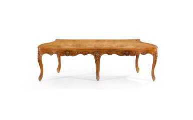 View full screen - View 1 of Lot 29. A LOUIS XV CARVED WALNUT BENCH, CIRCA 1740.
