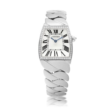 View full screen - View 1 of Lot 561. CARTIER | LA DONA, REF 2895, WHITE GOLD AND DIAMOND-SET WRISTWATCH WITH BRACELET CIRCA 2005.
