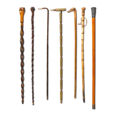 View full screen - View 1 of Lot 251. A collection of seven walking sticks and canes, late 19th/early 20th century.