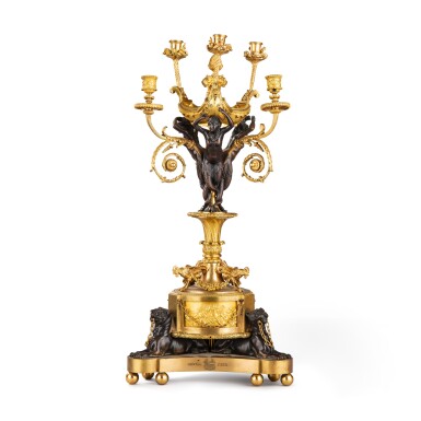 View full screen - View 1 of Lot 203. A Louis XVI style patinated and gilt bronze six-light candelabra of the "Independance of America", late 19th century, after a model by Pierre-Philippe Thomire | Candélabre à six lumières de "L'Indépendance Américaine" en bronze patiné et doré de style Louis XVI, fin XIXe siècle, d'après un modèle de Pierre-Philippe Thomire.