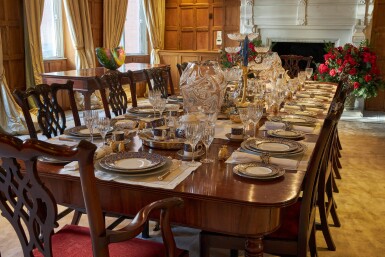 View full screen - View 1 of Lot 44. An early 19th C Mahogany Dining Table by Gillow & Co. with a set of 12 carved Dining Chairs in the Chippendale Style, and a Thomas Goode 'Stewart' bone china part dinner and dessert service, and an original antique glass from the Thomas Goode archive, various dates.