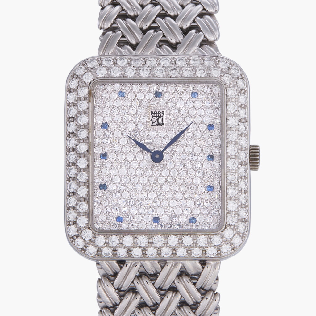 View full screen - View 1 of Lot 248. Reference 4636 | A white gold diamond and sapphire-set bracelet watch | Circa 1970.