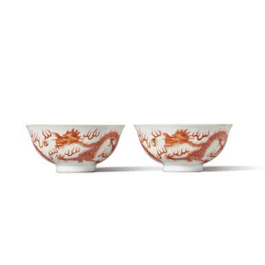 View full screen - View 1 of Lot 708. A pair of iron-red 'dragon and phoenix' bowls, Marks and period of Guangxu | 清光緒 礬紅彩龍鳳紋盌一對 《大清光緒年製》款.