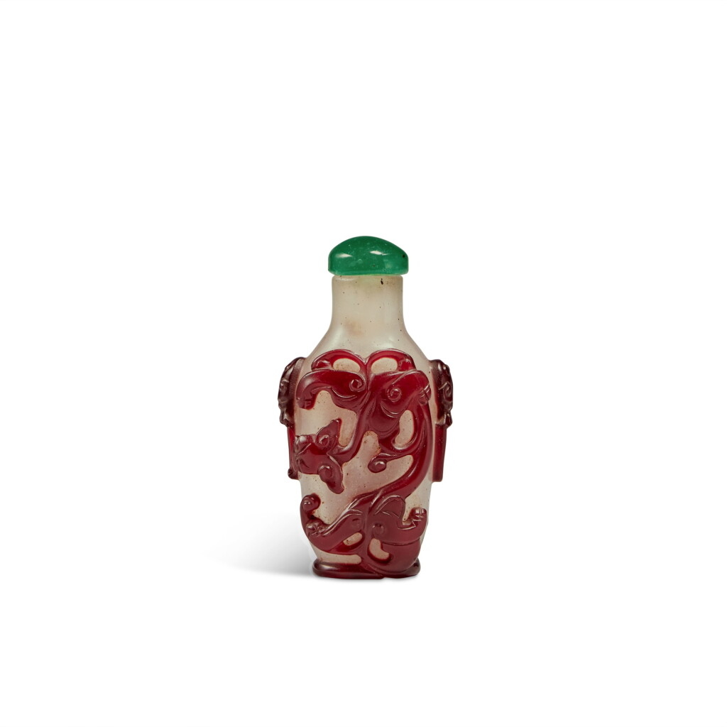 View full screen - View 1 of Lot 26. A red-overlay snowflake glass 'chilong' snuff bottle, Qing dynasty, 19th century.