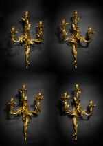 A set of four Louis XV gilt-bronze three-light wall appliques, circa 1750-55, attributed to Jacques Caffiéri