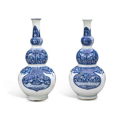 View full screen - View 1 of Lot 311. A pair of blue and white triple-gourd 'taotie' vases, Qing dynasty, Kangxi period | 清康熙 青花仿古饕餮紋三節葫蘆瓶一對.