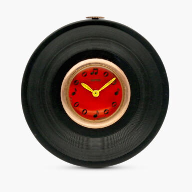 View full screen - View 1 of Lot 2140. A very rare and highly unusual pink gold and Galalith novelty watch in the form of a phonograph record, Circa 1938.