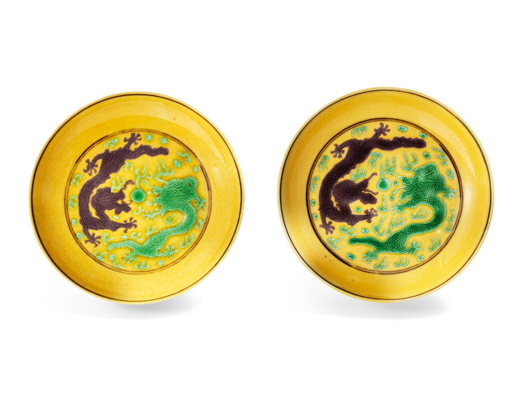 View full screen - View 1 of Lot 163. A pair of fine yellow-ground green and aubergine enamelled 'dragon' saucers marks and period of Guangxu | 清光緒 黃地紫綠彩雙龍戲珠紋小盤一對 《大清光緒年製》款.