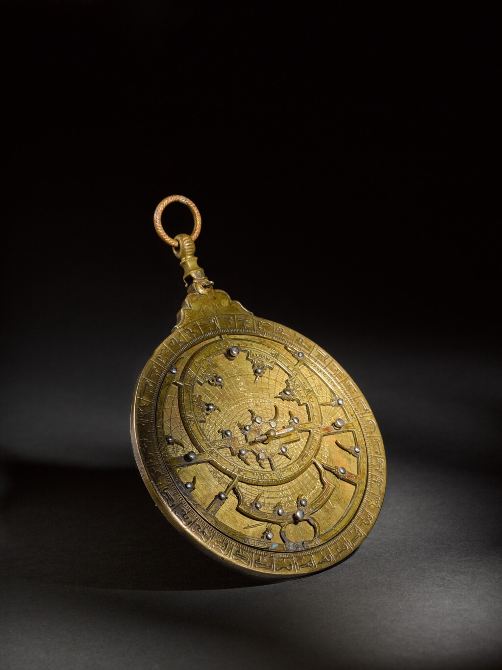 View full screen - View 1 of Lot 99. A brass astrolabe, attributable to the workshop of al-Hasan ibn Ahmad al-Battuti, Morocco, late 17th/early 18th century.