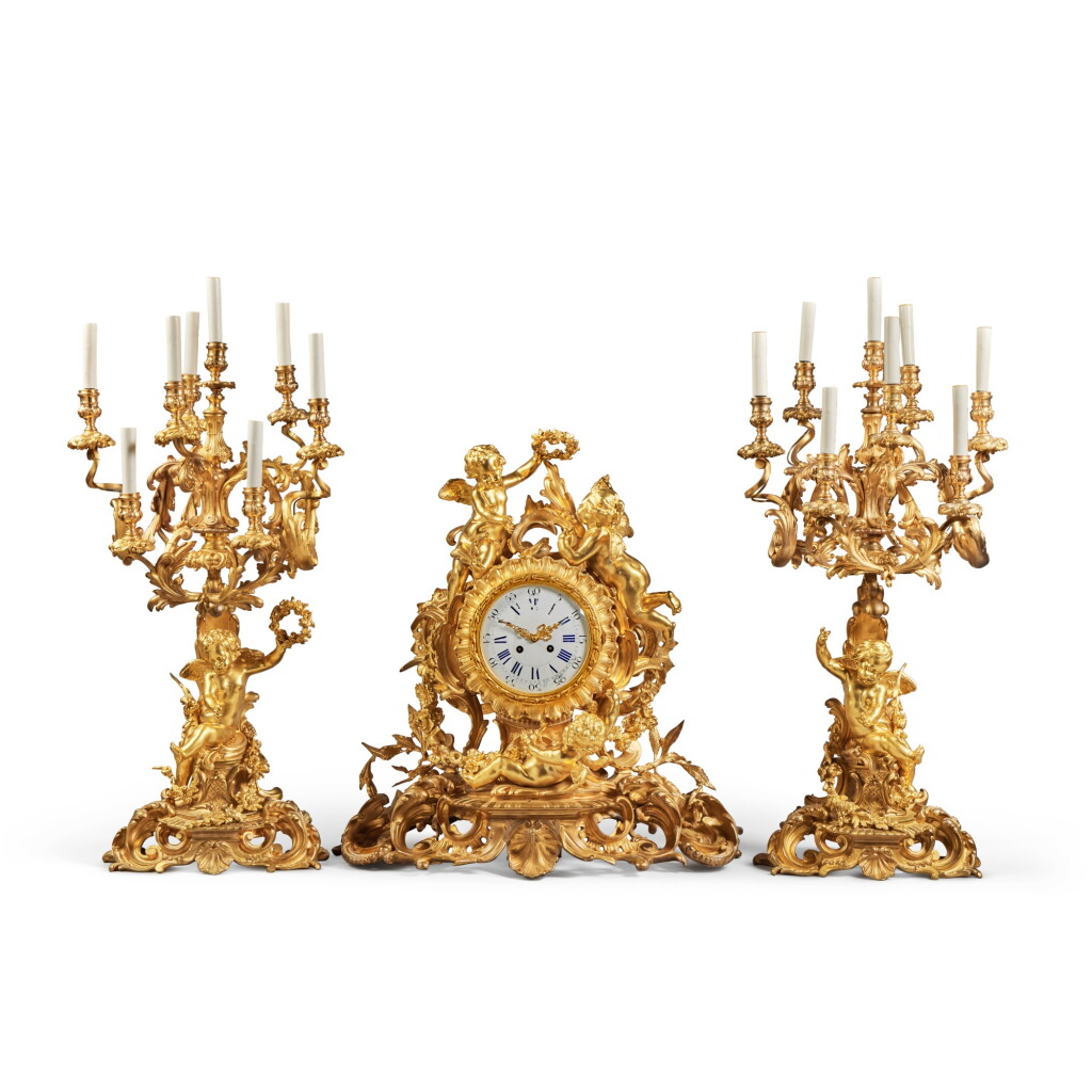 View full screen - View 1 of Lot 231. A Louis XV Style GIlt Bronze Clock Garniture, Late 19th Century.