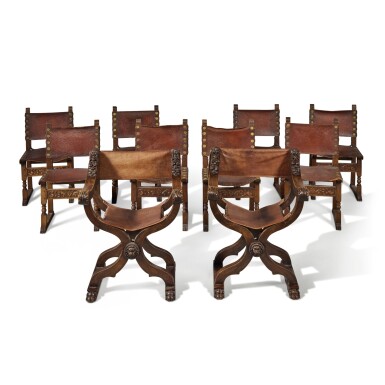 View full screen - View 1 of Lot 77. A Pair of Italian Renaissance Style Carved Walnut Savonarola Chairs, Late 19th Century.
