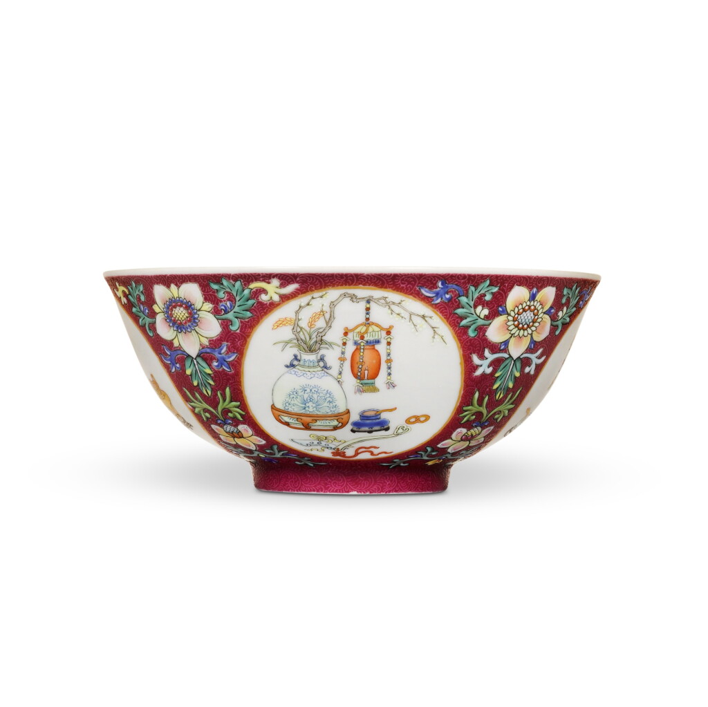 View full screen - View 1 of Lot 27. A fine ruby-ground famille-rose sgraffiato 'medallion' bowl, Seal mark and period of Daoguang | 清道光 粉彩胭脂紅地錦上添花開光博古圖盌 《大清道光年製》款.