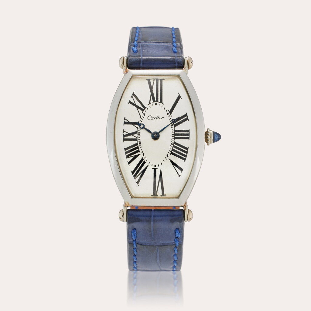 View full screen - View 1 of Lot 74. Tonneau | An early and rare platinum tonneau shaped wristwatch, Circa 1923.