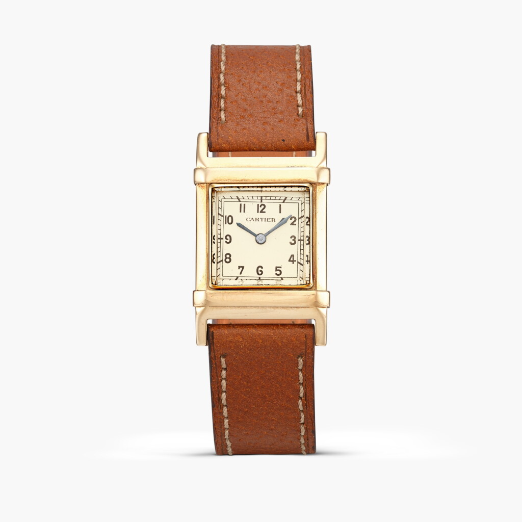 View full screen - View 1 of Lot 2488. Retailed by Cartier New York | A rectangular yellow gold ‘waterproof’ wristwatch, Circa 1937-40.