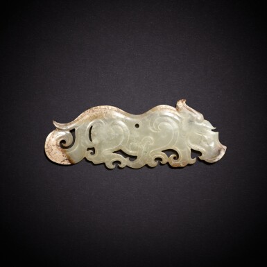 View full screen - View 1 of Lot 5660. A white jade 'tiger' pendant, Han dynasty | 漢 白玉虎紋珮.