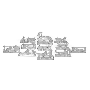 View full screen - View 1 of Lot 4. A cased set of twelve French knife rests, circa 1930, signed Benjamin Rabier.