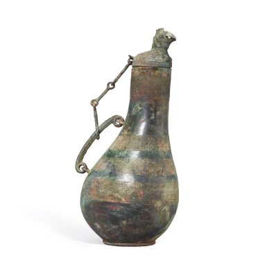 View full screen - View 1 of Lot 3006. A rare archaic bronze 'phoenix' ritual wine vessel and cover, Hu, Warring States period | 戰國 青銅蟠虺紋鳳首匏壺.