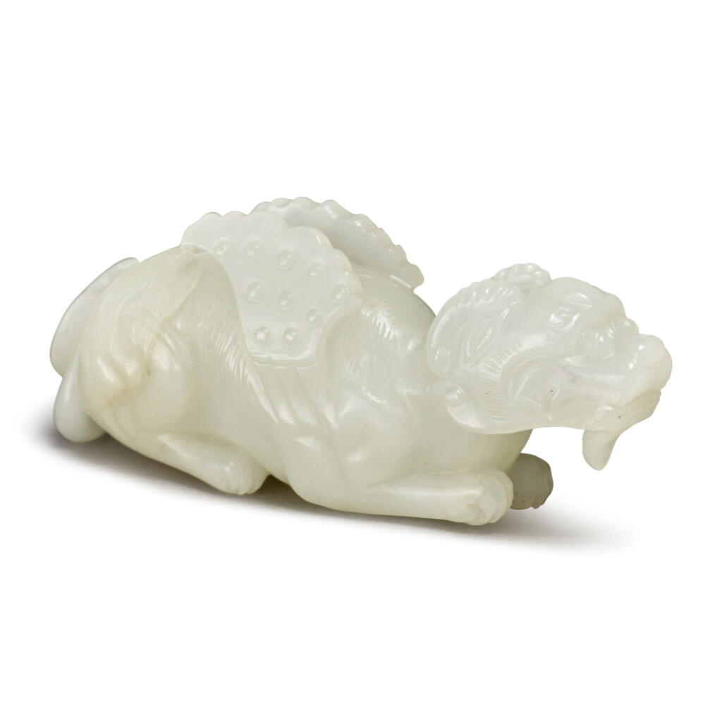 View full screen - View 1 of Lot 154. A white jade figure of a mythical beast, Qing dynasty, 18th / 19th century.