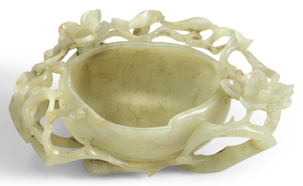 View full screen - View 1 of Lot 381. A PALE CELADON JADE 'PEACH' CUP 17TH CENTURY | 十七世紀 青白玉桃式花紋杯.