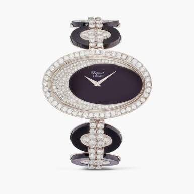 View full screen - View 1 of Lot 454. Reference 5038 1 | A white gold, onyx and pavé set diamond wristwatch with bracelet, Circa 1970.