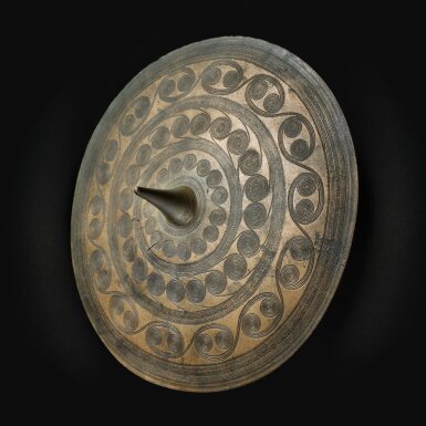 View full screen - View 1 of Lot 5. The Guennol Bronze Age Disc, Denmark, circa 1400-1200 B.C..