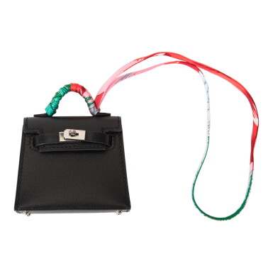 View full screen - View 1 of Lot 140. Black Mini Kelly Twilly Bag Charm in Tadelakt Leather, Silk Twill and Silver Tone Hardware, 2020.