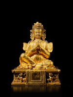 A gilt-copper alloy figure of Dharma King Gewa Pel, Tibet, late 17th / early 18th century