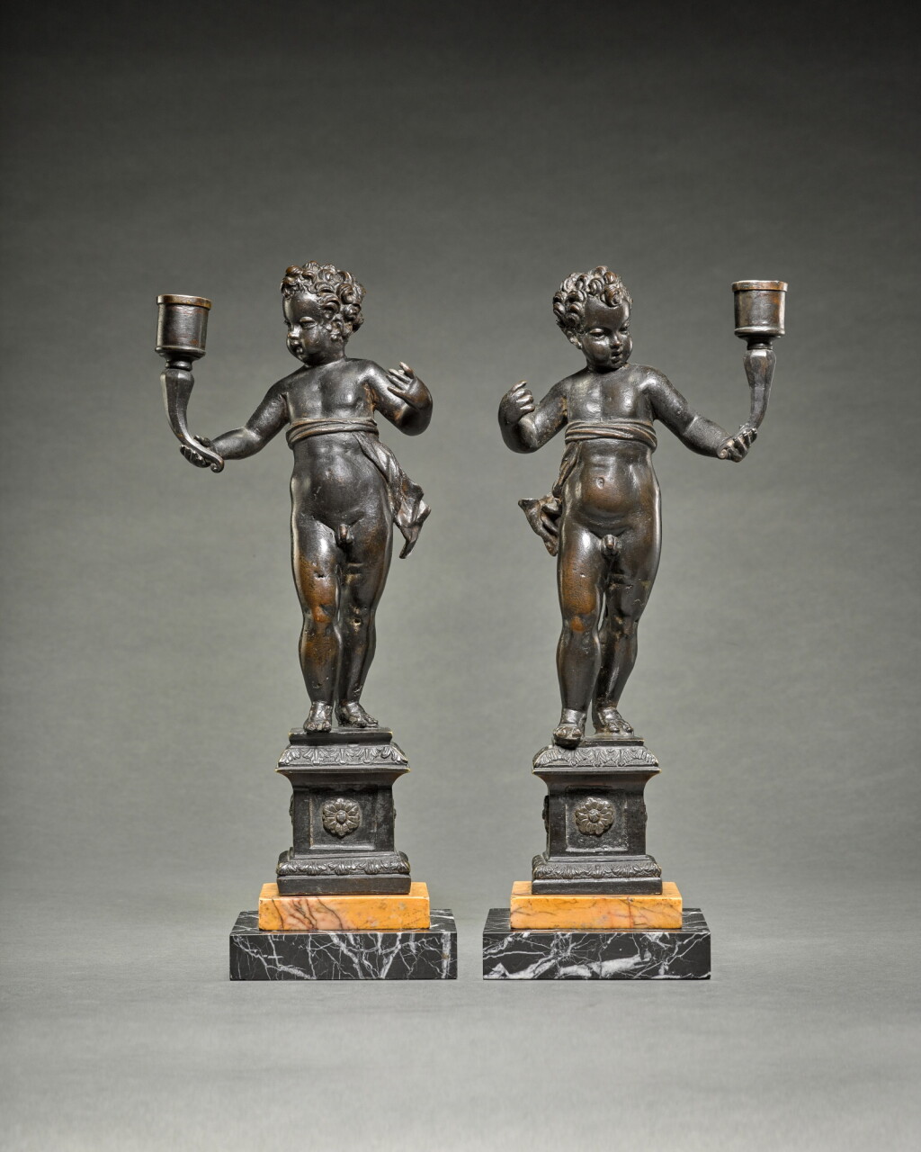 View full screen - View 1 of Lot 329. Pair of candlebearing Putti.