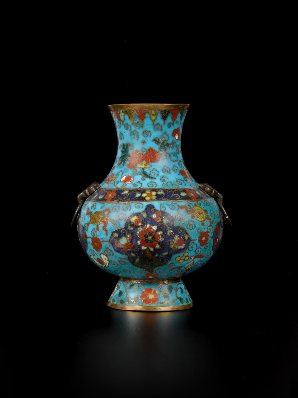 View full screen - View 1 of Lot 106. A small cloisonné enamel hu-form vase, Ming dynasty, 17th century | 明十七世紀 掐絲琺瑯花卉紋雙耳壺.