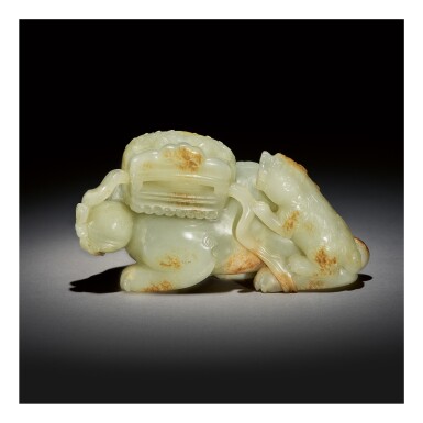 View full screen - View 1 of Lot 232. A LARGE PALE CELADON AND RUSSET JADE 'BUDDHIST LION' GROUP, QING DYNASTY, QIANLONG PERIOD.
