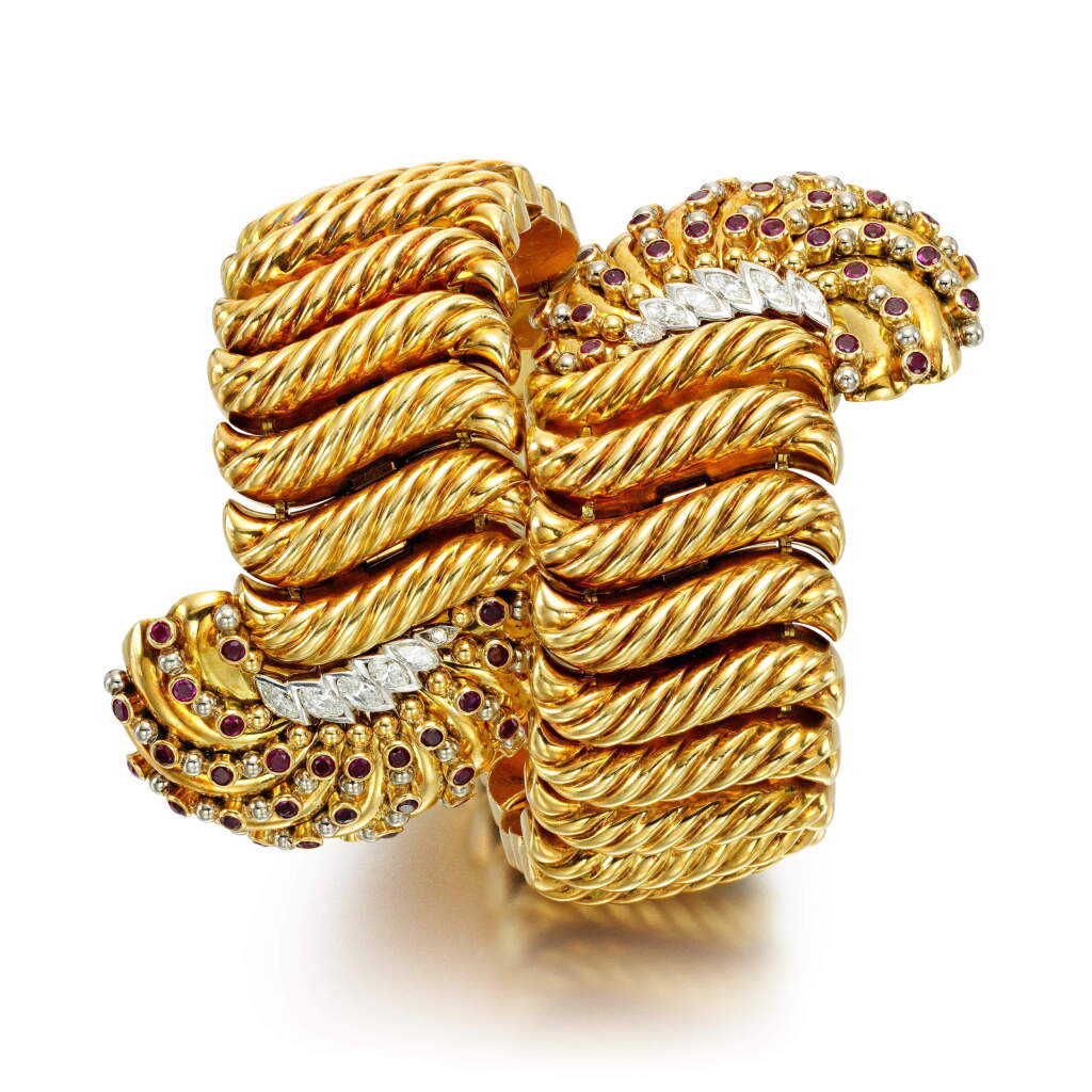 View full screen - View 1 of Lot 165. A diamond and ruby bangle.